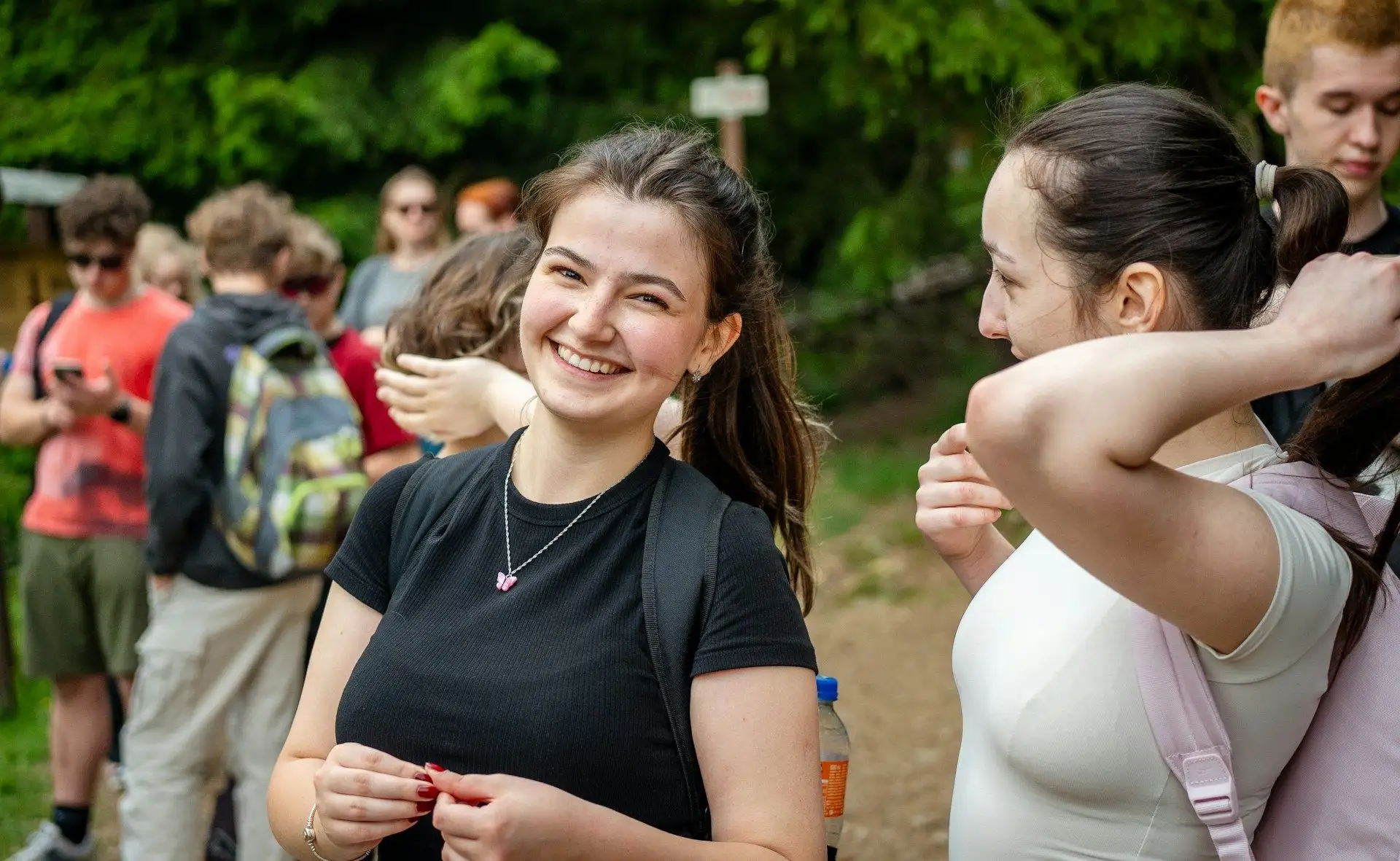 Smiling students on an outdoor group walk