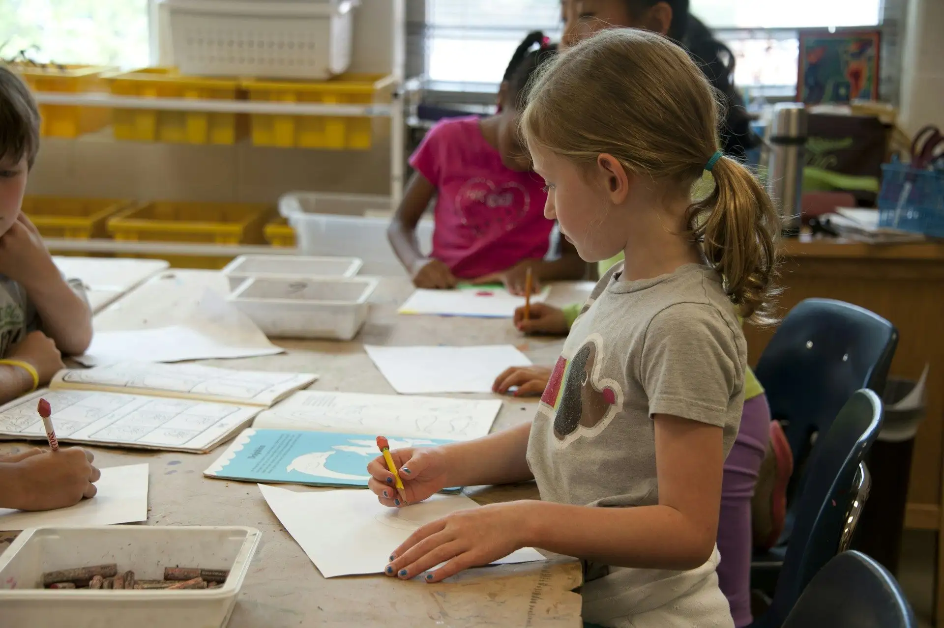 A student working at a learning table in a classroom