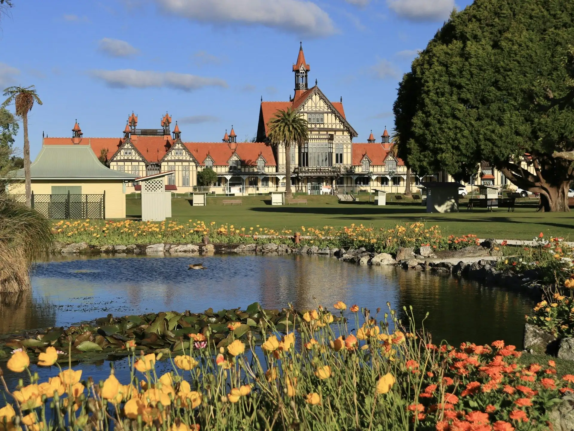 Rotorua Museum's Tudor-style building behind spring flowers in the Government Gardens