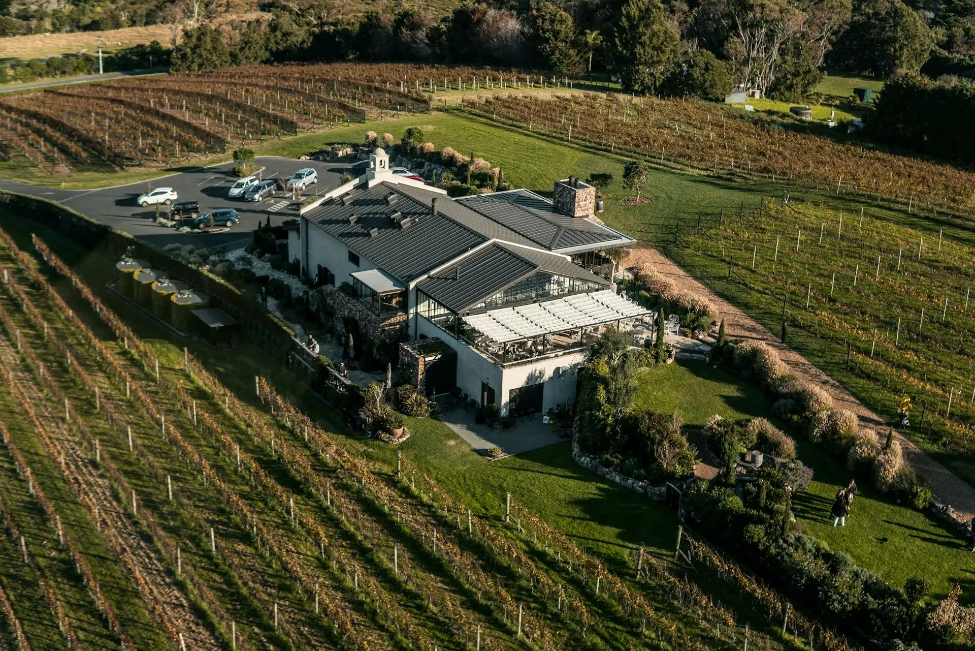 A boutique vineyard estate and restaurant among its vines, seen from above, Waiheke Island
