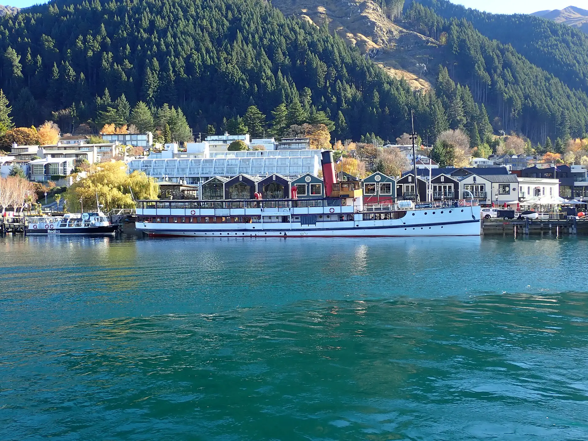 Vintage steamship TSS Earnslaw moored on turquoise Lake Wakatipu