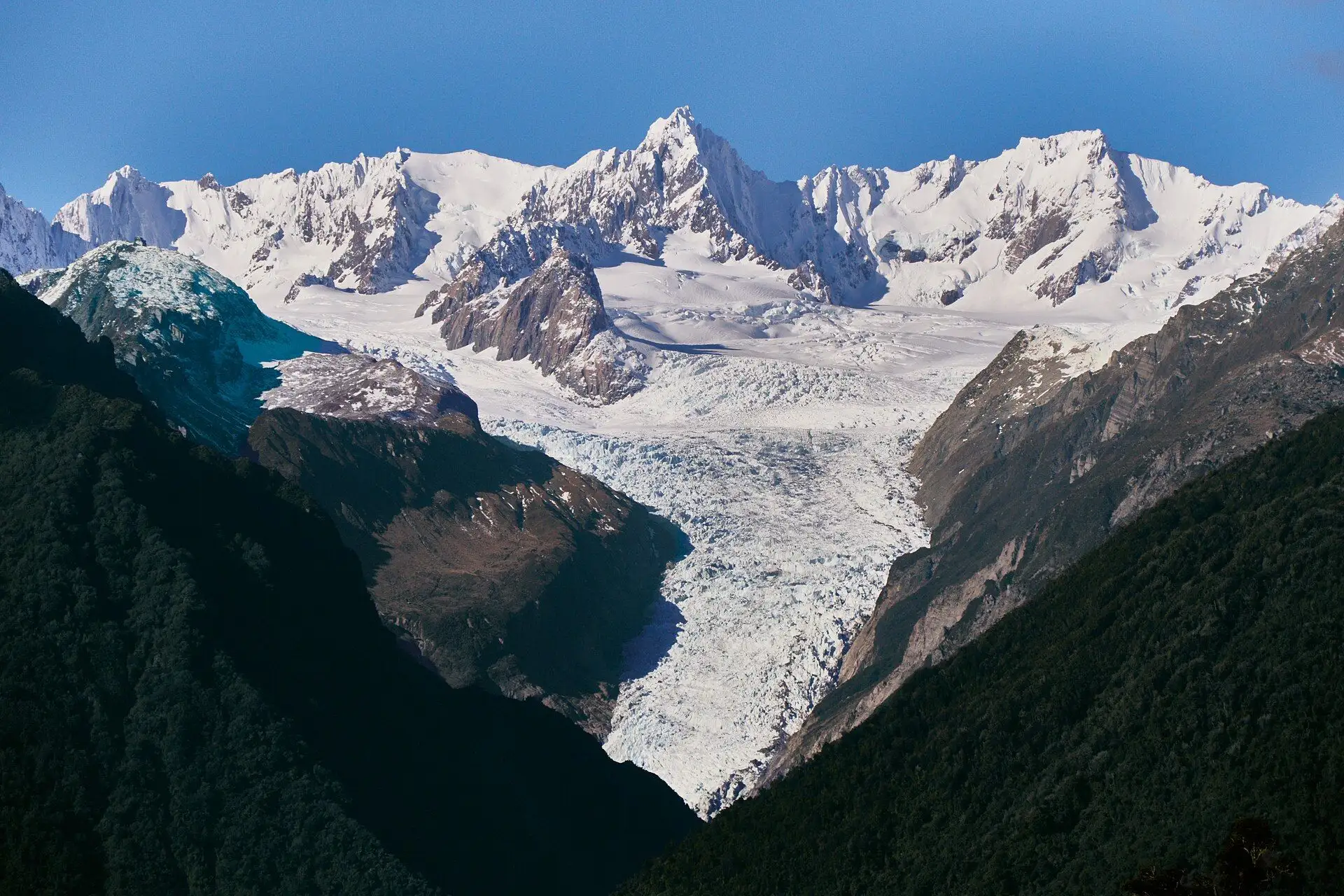 The icefall of Fox Glacier between snow-covered peaks