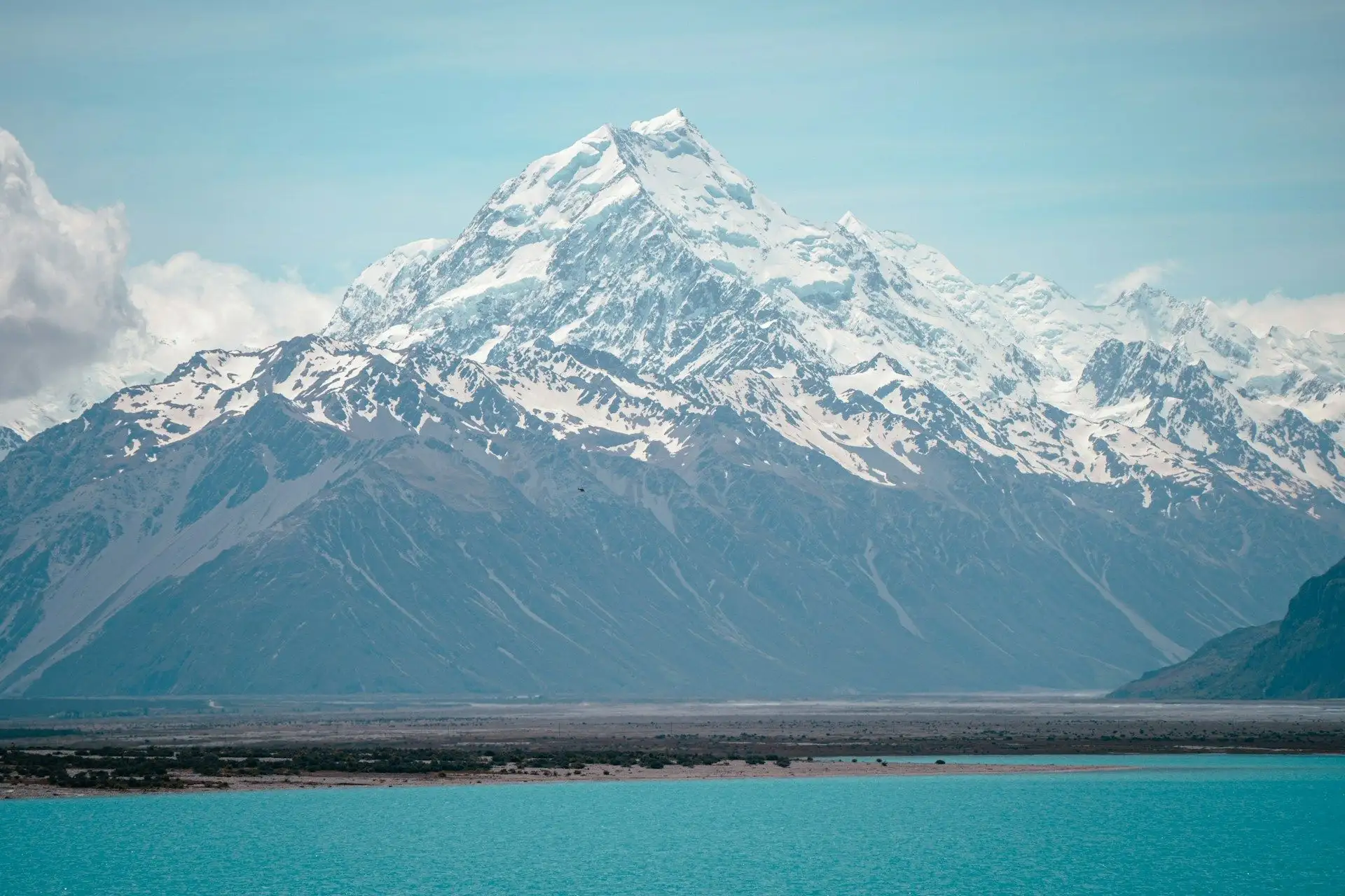 Snow-covered Aoraki / Mount Cook rising above turquoise Lake Pukaki