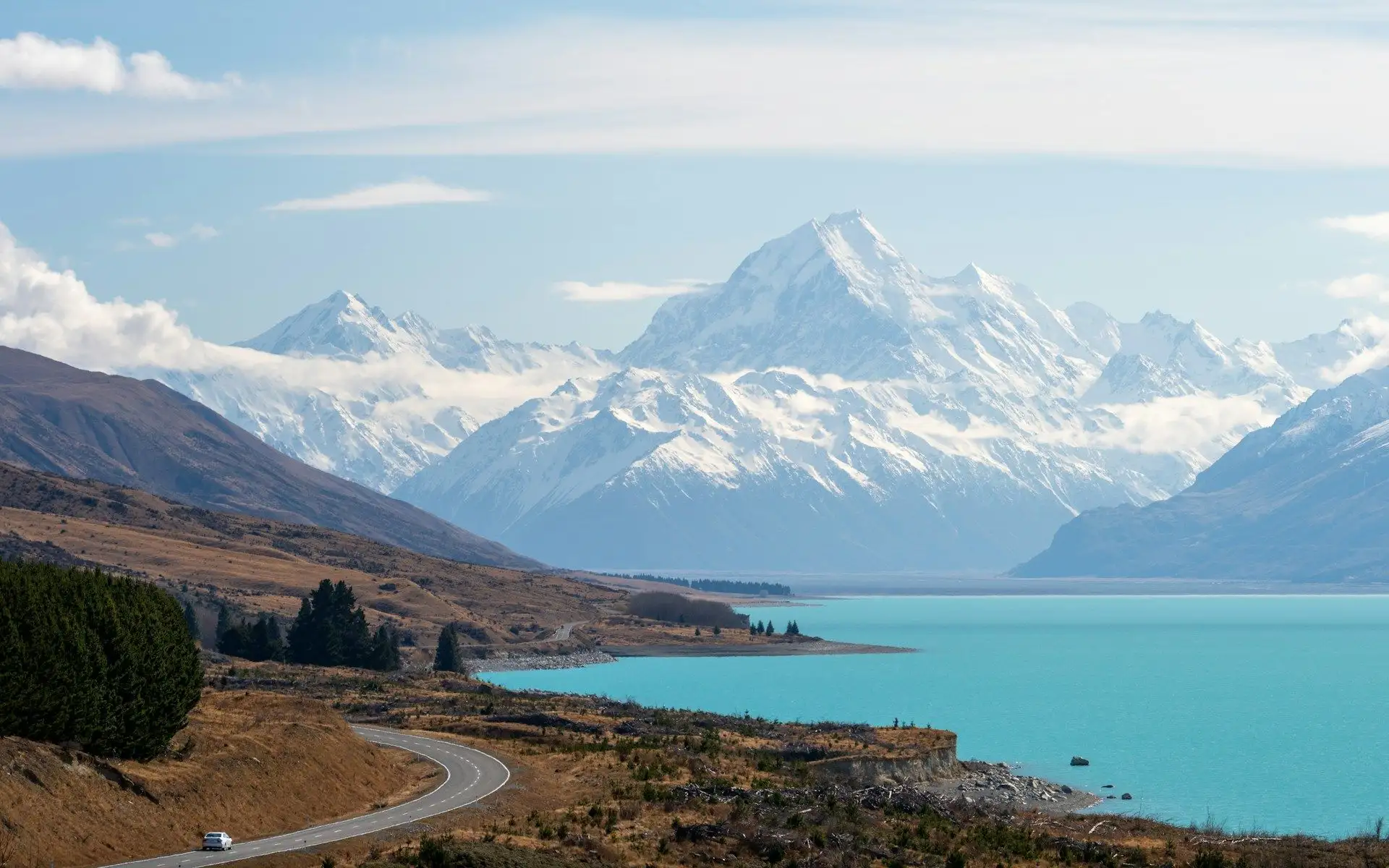 Lake Pukaki's turquoise water below Aoraki / Mount Cook, with the road beside it